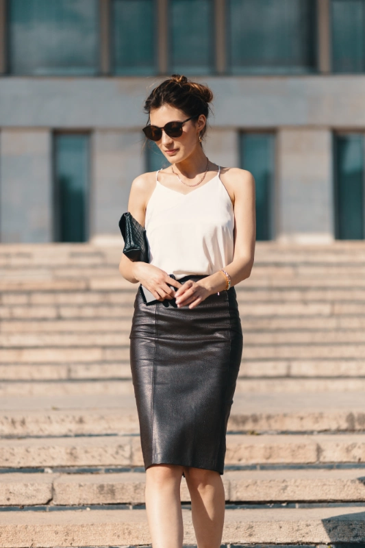 2024 fashion trends: a woman in a leather skirt
