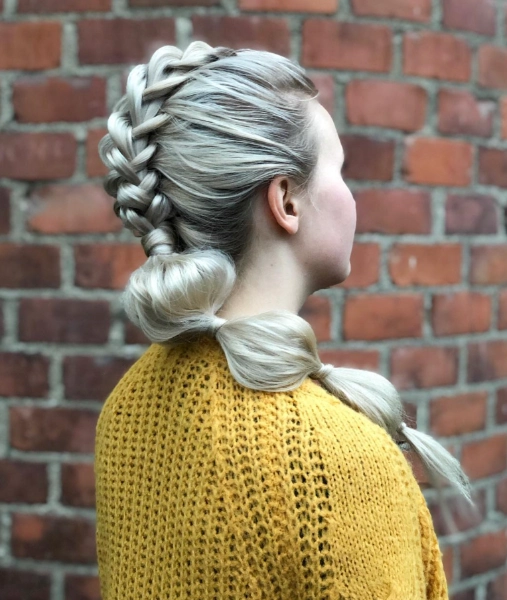a young woman with white/grey mohawk buuble braids
