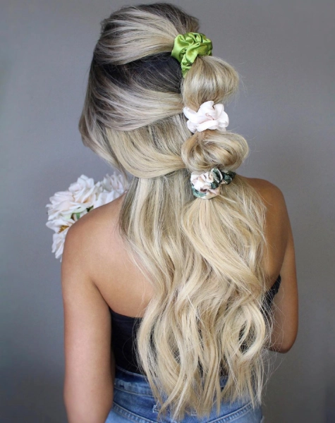 a young woman with blonde scrunchie bubble braids