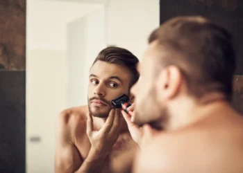 a man doing his Beard grooming routine