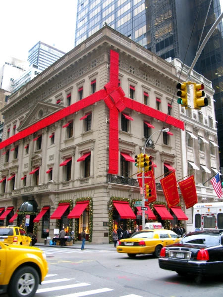 a christmas themed building with a big red ribbon