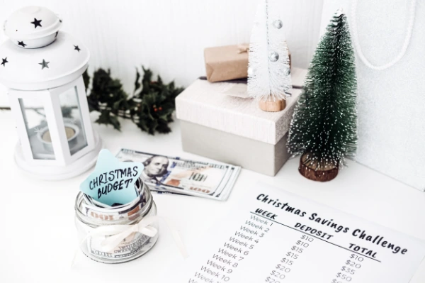 a decorated table with money and a savings list