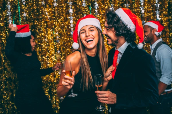 a christmas party where the guests wearing santa hats