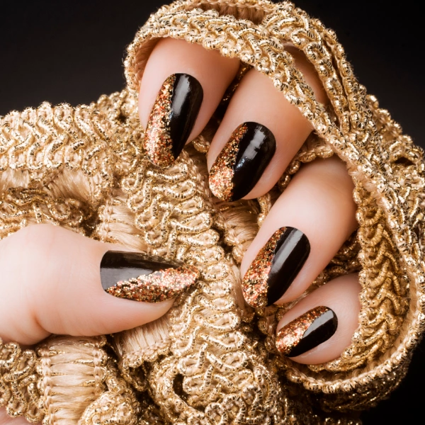 half golden glitter and half black nails