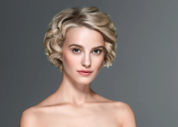 elegant short haircuts: a young woman with an old fashioned hair cut