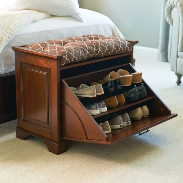 a brown shoe cabinet that is also a stool