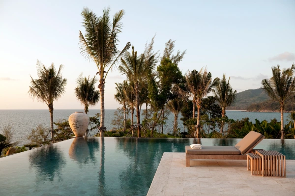 a hotel outdoor area with an infinity pool and sea view