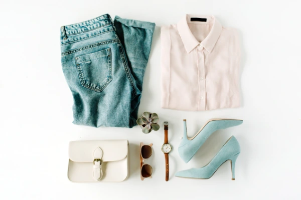 a modern pastel outfit laying on white ground