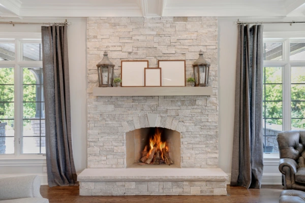 a light grey stone fireplace