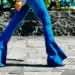 a woman walking in a flare jeans
