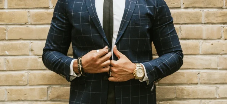 a men wearing a blue white checkered suit with mens suit accessory